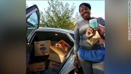 Chrishawndra Matthews getting ready to deliver a car full of books. 